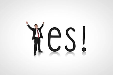 Yes! Conceptual composition of a happy expressive businessman and alphabetの写真素材