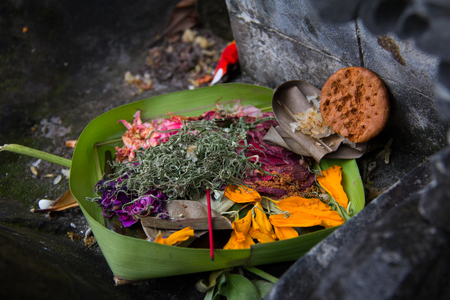 Various objects in a leaf basket as offerings to God in Balinese Hindu traditionの写真素材