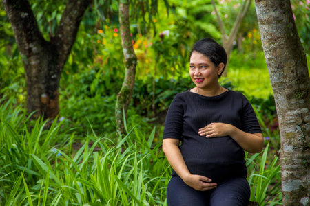 Pregnant woman in natural backgroundの写真素材