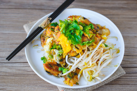fried mussel pancake with old wooden background, Thai Cuisine, Thai Foodの写真素材