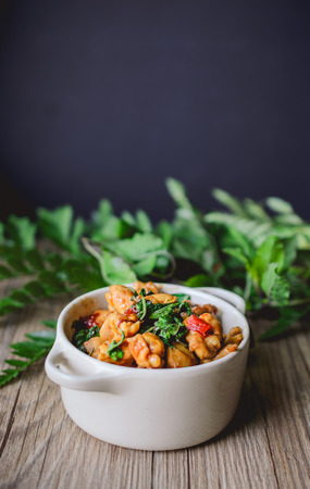 Stir Fried Basil Cicken on wooden, Thai Famous Food, Thai Street Food, Thai Cuisine, Thai Spicy Foodの写真素材