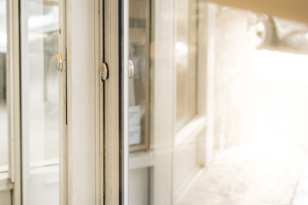 Locking up or unlocking door of restaurant with morning light for ad or website promoteの写真素材