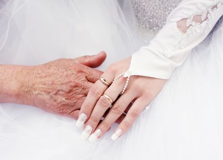 hand in hand bride and old womanの写真素材