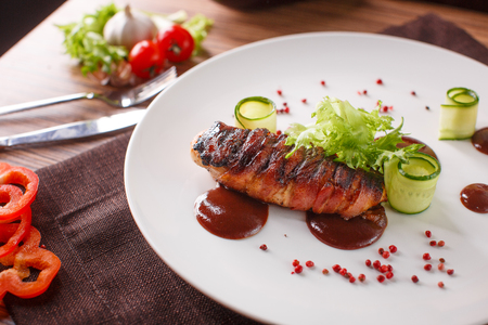 Delicious meat loaf with ketchup on a white plate, macro horizontalの写真素材