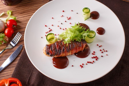 Delicious meat loaf with ketchup on a white plate, macro horizontalの写真素材