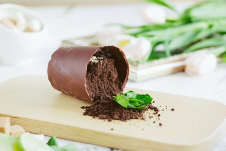 mocha mint coffee and milk foam,Peppermint mocha latte and dry flower with white pot on white backgroundの写真素材