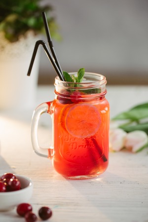 Sangria with oranges and strawberries copy space white backgroundの写真素材
