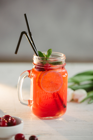 Sangria with oranges and strawberries copy space white backgroundの写真素材
