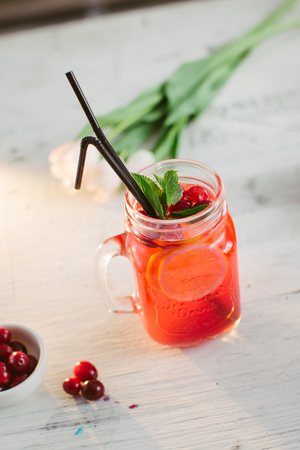 Sangria with oranges and strawberries copy space white backgroundの写真素材