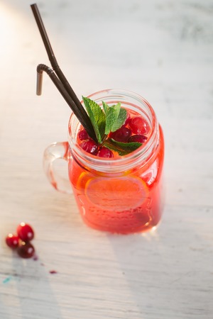 Sangria with oranges and strawberries copy space white backgroundの写真素材