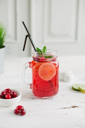 Sangria with oranges and strawberries copy space white backgroundの写真素材