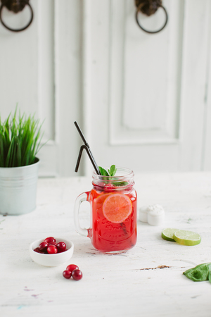 Sangria with oranges and strawberries copy space white backgroundの写真素材