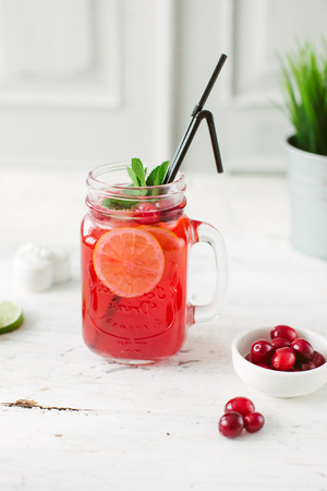 Sangria with oranges and strawberries copy space white backgroundの写真素材