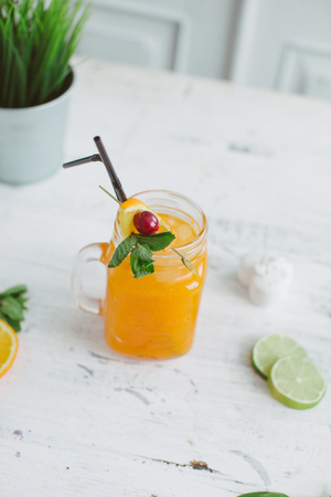Sangria with oranges and strawberries copy space white backgroundの写真素材