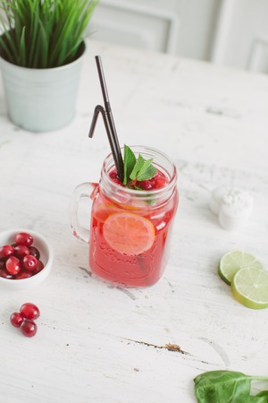 Sangria with oranges and strawberries copy space white backgroundの写真素材