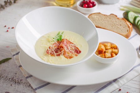 Cheese soup with roast bacon, herbs and spicesの写真素材