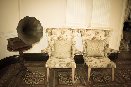 Old retro gramophone in the old style living roomの写真素材