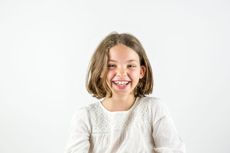 Happy girl portrait isolated on white.