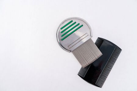 Steel and plastic lice treatment louse comb, isolated on white.の写真素材