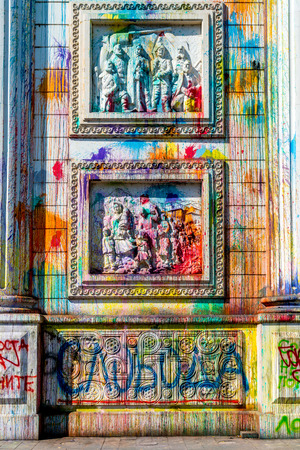 Vandalism of the triumphal arch in Skopje. Skopje, Macedonia - September 24, 2016: Splashes of color on Porta Macedonia, the triumphal arch in the center of Skopje. Color traces after manifestation.のeditorial素材