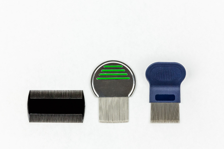 Three different kinds of lice combs. Studio shot on white background with copy space.の写真素材