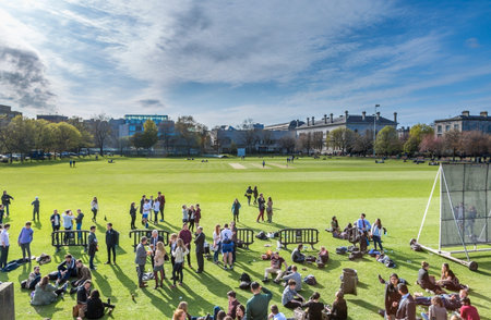 Students and teachers on Campus. Trinity College, Dublin, Ireland - April 23, 2016: Students and...