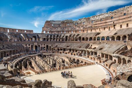 View of the inside of Colosseum in Rome Italy.  Rome, Italy - April 22, 2015: Inside view of the Colosseum in Rome Italy April 22, 2015. Group of people in the foreground.  Wide view of the Colosseum.のeditorial素材
