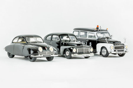 Stockholm, Sweden - August 17, 2017: Close up studio shot of three isolated Swedish classic cars, no people. Scale model of black SAAB 92001, Volvo PV 444 and police car Volvo PV 445 Duett.のeditorial素材