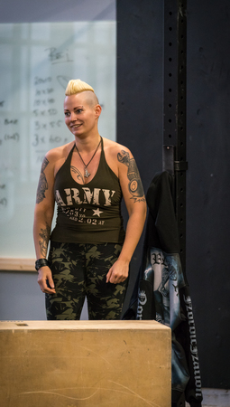 STOCKHOLM, SWEDEN - JANUARY 13, 2018: Portrait of a young fit blond caucasian woman with tattooes and army workout clothes at the event Arm Battle of Sweden outside of Stockholm January 13, 2018.のeditorial素材