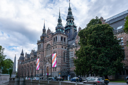 STOCKHOLM, SWEDEN - JUNE 7, 2014: Outdoor side view of the famous Nordic Museum, entrance with cars...