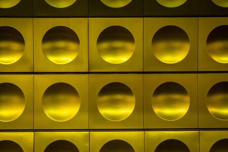 Beautiful abstract shiny golden metallic steel pattern. Circles on iron plates.の写真素材