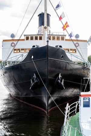 STOCKHOLM, SWEDEN - JULY 20, 2021: Front bow view of the old vintage steamship Sankt Erik moored in...