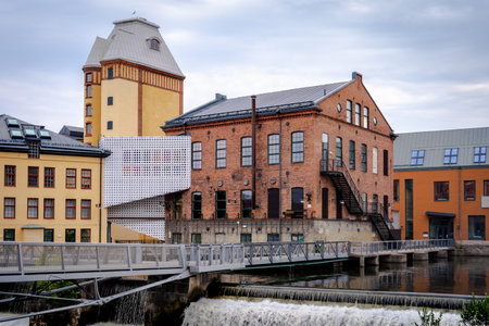 NORRKOPING, SWEDEN - JULY 27, 2021: Beautiful cityscape with old industrial buildings and water reservoir. Linkoping University campus in Norrkoping July 27, 2021.のeditorial素材