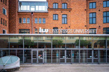 NORRKOPING, SWEDEN - JULY 27, 2021: Front facade view of Linkoping University campus, red brick building in Norrkoping Sweden July 27, 2021.のeditorial素材
