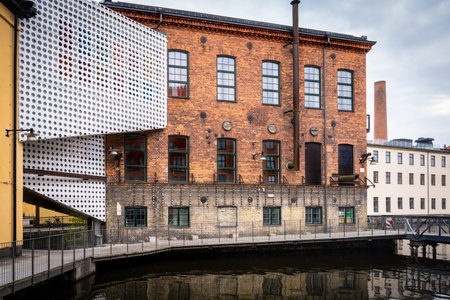 Old vintage red brick industrial building with water reservoir in Norrkoping Sweden.