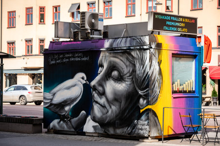 STOCKHOLM, SWEDEN - APRIL 16, 2022: City street view of a spray painted portrait of famous deceased author Astrid Lindgren on a food truck stand down town, Stockholm Sweden April 16, 2022.のeditorial素材