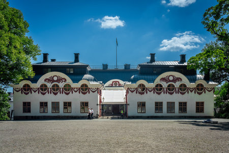 STOCKHOLM, SWEDEN - JUNE 27, 2024: The back of Karlberg Palace Military Academy with a gravel field, incidental people and sky in the background. Stockholm Sweden June 27, 2024.のeditorial素材