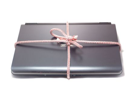 Closed notebook with rope as gift, isolated on whiteの写真素材