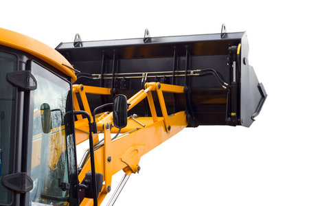 close-up yellow excavator cabine and bucket, isolated on white