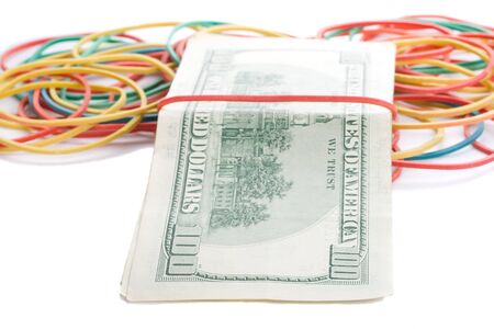 concept last dollars in desk, few dollars and many empty rubber band, isolated on whiteの写真素材
