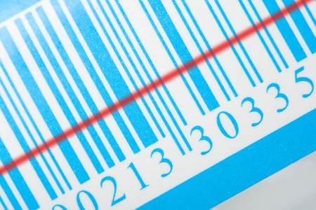 close-up blue barcode with red laser stripの写真素材