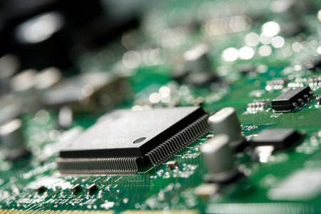 close-up microchip on green circuit board, selective focus