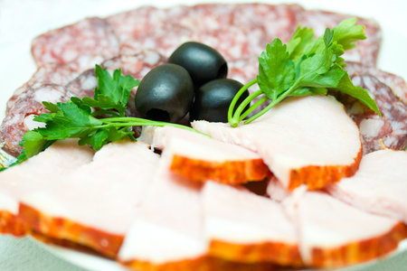 set of sausage  and olives, on plate