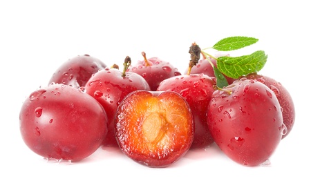 wet ripe plums, isolated on whiteの写真素材