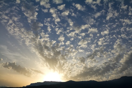 beautiful cloudscape at sunset in mountainsの写真素材