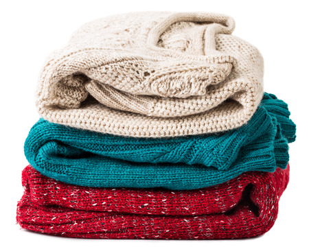 close-up Stack of warm sweaters, isolated on whiteの写真素材