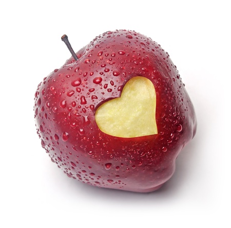 Fresh red apple with a heart symbol against white background Fresh red apple with a heart symbol against white background