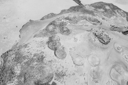 An old vulcanic rock formation in black and whiteの写真素材