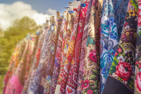 Russian colorful traditional scarfs for sale in a gift shop, shallow depth of scene