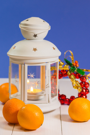 Christmas lantern with tangerines の写真素材